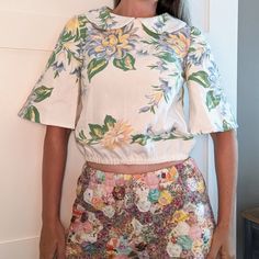 This Fabric Was Originally A Vintage Cotton Tablecloth! It Was Damaged, So We Just Used The "Good Parts" To Make This. Popover, With A Button Keyhole Closure At The Back Of The Neck. Elasticized Bottom Hem. Fits A S. Please Compare The Measurements Below With A Blouse You Have At Home That Fits Well. This Is Unused As A Blouse, But It Did Have A Previous Life As A Tablecloth, So There Are A Couple Of Tiny Imperfections, As Pictured. Nothing That Detracts... This Is A One-Of-A-Kind Piece! The Qui Vintage Cotton Tops For Brunch, Retro Cream Tops For Spring, Retro Cream Top For Spring, Vintage Blouse For Spring Garden Party, Retro White Blouse For Spring, White Retro Blouse For Spring, White Floral Print Top For Garden Party, White Floral Print Blouse For Garden Party, Retro White Spring Blouse