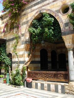 an old building with vines growing on it