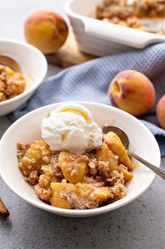 two bowls filled with apple crisp and ice cream