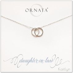 two intertwined rings on a silver chain with the name ornata written in it