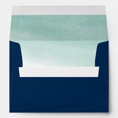 an envelope with blue and green watercolor paper on the front, featuring a white stripe