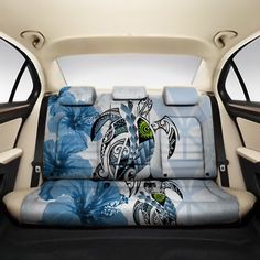 the interior of a car with blue flowers and an image of a turtle on it