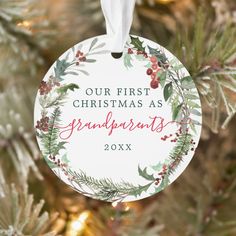 a personalized christmas ornament hanging from a tree