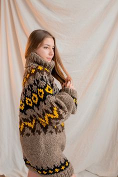 Winter Wool Sweater With Funnel Neck, Wool Funnel Neck Sweater For Winter, Oversized Warm Turtleneck Sweater, Warm Oversized Turtleneck Sweater, Oversized Turtleneck Warm Sweater, Oversized Brown Turtleneck Outerwear, Cozy Chunky Knit Turtleneck Outerwear, High Neck Wool Sweater For Winter, Beige Nordic Sweater For Fall