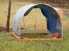 an outdoor shelter in the middle of a field