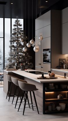 a modern kitchen with an island and christmas tree