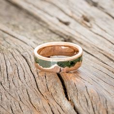 a wooden surface with a ring on it