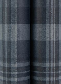 a close up view of the fabric on a plaid pattern material that is grey and black