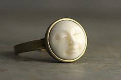 I always loved and admired this kind of moon face cabochons. In former times, they were carved out of ivory which is, thank goodness!, forbidden nowadays. Yet the ones you can get nowadays are still made from animal bones.  With this ring, you get the animal friendly alternative because, believe it or not, the moon face is made out of eco-friendly resin.  So the stone is completely handmade - from mold making to polishing.  This is why every little man in the moon will look slightly different... Rings For Women Daily Wear, Vintage Moon Rings, Interesting Rings, Face Ring, Handmade Gold Moon Shaped Ring, Moon Face Ring, Piercing Face, Unique Moon-shaped Brass Jewelry, Spiritual Gold Moon-shaped Ring