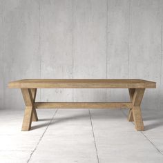 a wooden bench sitting on top of a white tile floor in front of a concrete wall