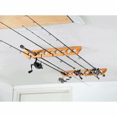 fishing rods and reels hang from the ceiling