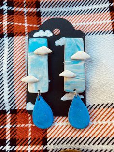 Rainy day earrings! A unique set that also is a stud back earring for comfort! Lightweight and easy to wear. Would make a wonderful gift! (Disclaimer - each set may vary slightly. each are handmade to order, so no two will look the same) Unique Studs, Jewelry Cute, Blue Clouds, Cute Gift, Jewelry Earrings Studs, Rainy Day, Cute Gifts, Sky Blue, Blue Sky