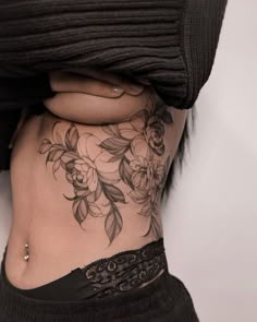 a woman's stomach with flowers on it