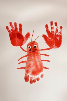 a drawing of a red crab with two hands in the shape of a handprint