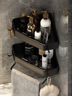 two black shelves holding cosmetics and personal care items in a bathroom area with marble walls