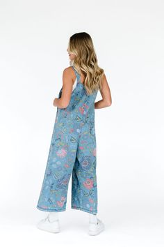 The floral embroidered women's denim overalls are a must have for the Spring/Summer months. Rarely do you get to sport an outfit which will entail endless compliments like these bib overalls. They feature an oversized and loose fit with adjustable straps and distressed details. Model Measurements: Hips 34” Waist 25” Bust 32” Height 5’6.5, wearing a size small 100% Cotton Measurements S: Hips: 42"| Length: 44.5" (taken from top of front of overalls to ankle cuff) M: Hips: 46" | Length: 45" (taken Patterned Overalls, Embroidered Outfit, Aesthetic Overalls, Womens Denim Overalls, Teaching Outfits, Weekly Outfits, Floral Denim, Bib Overalls, Embroidered Clothes