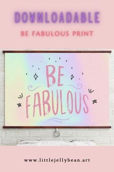 a poster with the words be fabulous in pink and blue, on a white brick wall