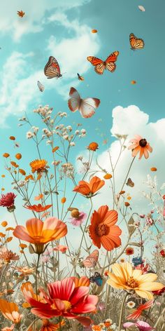 a field full of flowers and butterflies flying in the sky