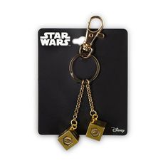 star wars keychain with two dices attached to the front and back of it