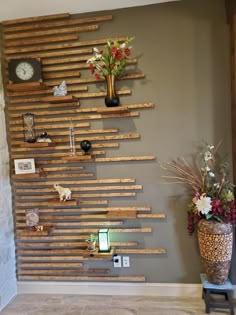 a wall made out of wooden planks with flowers and pictures on the wall next to it