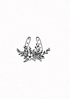 a black and white drawing of two scissors with flowers on the end of each one