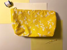 * 8 inch by 5 inch zipper pouch * Yellow with white butterflies print * Light yellow polyester zipper * Beige canvas lining fabric * Multipurpose, can fit several small items including most phones and wallets * Handmade from quality repurposed fabric, made with love and care! Details: Yellow and White Butterfly Print Zipper Pouch, Handmade Cotton Purses & Clutches, Cute Multipurpose Repurposed Fabric Zipper Pouches Repurposed Fabric, Yellow Butterflies, White Butterflies, Cotton Purse, Pouch Handmade, Zipper Pouches, Yellow Butterfly, White Butterfly, Coin Purses