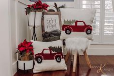 two knitted christmas pillows on a chair