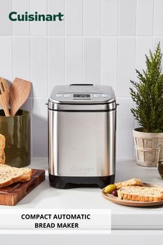 a toaster sitting on top of a counter next to bread