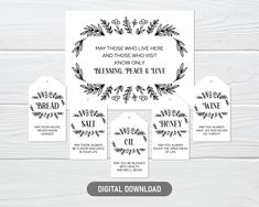 the printable wedding stationery is displayed on a white wooden background with black and white flowers