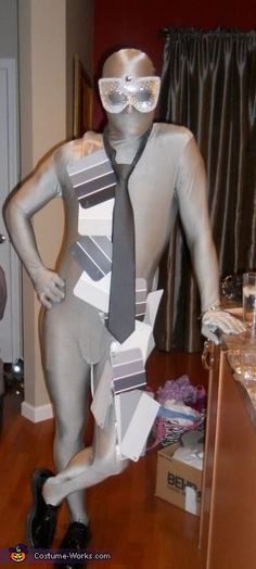 a mannequin is dressed up as a man in a suit and tie with glasses