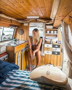 a woman is sitting in the cabin of a boat