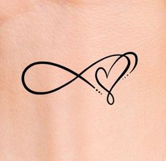 an infinite love tattoo on the back of a woman's stomach, with a heart in