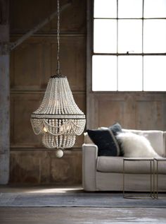 Classic style meets modern charm with this chandelier. A bevy of draped wooden beads in weathered white, dresses up the steel structure, bringing out an earthy glamour to any space. Dimensions: 37.5H x 20.5W X 20.5D Max Height: 111 Canopy: 5 x 5 x 1 UL Rating: Dry Wattage: 40 Watt Max Bulb Qty: 6 Bulb Type: B Type Candelabra Base (E12) Socket: E12 Candelabra Wiring Type: Hard Wire Chain: 6 ft. Cord: 10 feet Sloped Ceiling Compatible: Yes Material: Birch Wood Finish: White Weight: 28 Care Instruc Wooden Bead Chandelier, Wood Bead Chandelier, Blue Chandelier, Weathered White, White Chandelier, 3d Modelle, Beaded Chandelier, Chandelier For Sale, Burke Decor