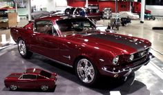 a red car is on display in a showroom