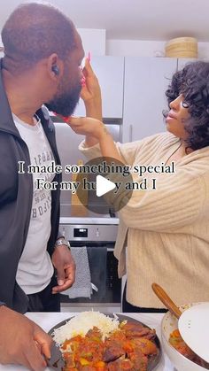 a man and woman standing next to each other in front of a plate of food