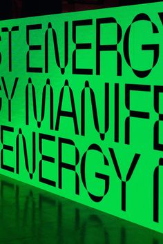 a green sign with black lettering on it that says, stop energy by manufer energy