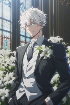 a man in a suit and tie standing next to white flowers with his hands on his hips