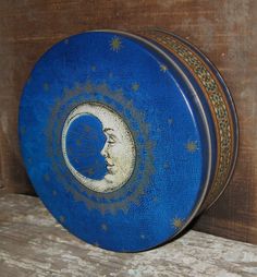 a blue plate with a crescent moon painted on it