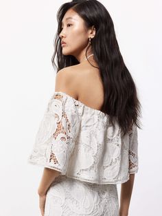 MO&Co. Women's Off Shoulder Lace Blouse Made from a comfy cotton blend, this short blouse features delicate lace embroidery and an alluring off-shoulder design. Perfectly paired with our matching skirt for a fashionable, yet casual look. Features : - Regular cropped fit- Off-shoulder with hanging neck strap- Sophisticated eyelet embroidery Code: MBD2TOP042The back length of size S is 26.5cmMATERIALS & CARE Material: 93.4% Cotton 6.6% PolyamideREMINDER: All items are measured manually. Please not Feminine Scalloped Lace Blouse For Summer, Elegant Lace Crochet Top For Day Out, Off-shoulder Lace Top Blouse For Summer, Chic Lace Top With Broderie Anglaise, Fitted Lace Off-shoulder Blouse, White Feminine Off-shoulder Top For Day Out, Chic Off-shoulder Lace Top, Spring Off-shoulder Lace Blouse, Off-shoulder Lace Top Blouse For Spring