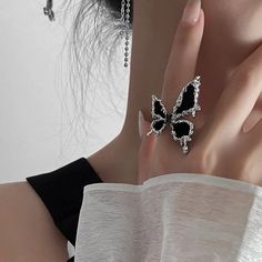 ✦ Unleash your dark and enchanting side with our Gothic Black Butterfly Open Ring. This captivating ring features a beautifully detailed butterfly design in a gothic black finish. Embracing the essence of both beauty and darkness, this ring is a unique blend of elegance and edge. The open design adds a contemporary twist, allowing for an adjustable and comfortable fit. Whether you're a fan of gothic aesthetics or simply adore the mystique of butterflies, this ring is the perfect accessory to exp Black Cocktail Ring, Insect Ring, Butterfly Rings, Ring Party Jewelry, Engagement Rings Couple, Y2k Accessories, Trendy Ring, Animal Rings, Butterfly Ring