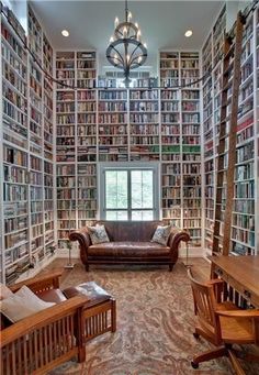 a room filled with lots of books and furniture