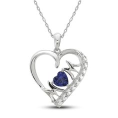 This beautiful and sentimental necklace for Mom features a heart-shaped pendant embellished with sparkling round-cut white lab-created sapphires along one side. The word 'MOM' graces the inside, with a gorgeous heart-cut blue lab-created sapphire in the center. The sterling silver pendant hangs from an 18-inch cable chain and secures with a lobster clasp. Sapphire Heart Pendant Birthstone Jewelry, Sapphire Heart Pendant For Anniversary, Anniversary Sapphire Jewelry With Heart Charm, Heart Cut Jewelry For Mother's Day, Blue Heart-shaped Jewelry For Mother's Day, Blue Heart Pendant Jewelry For Mother's Day, Heart Cut Gemstone Jewelry For Mother's Day, Mother's Day Heart Cut Gemstone Jewelry, Personalized Blue Heart Pendant Jewelry