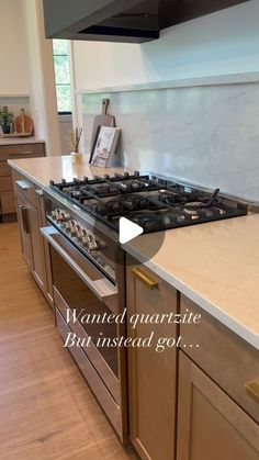 a stove top oven sitting inside of a kitchen