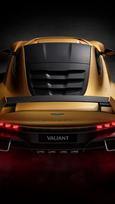 the rear end of a yellow sports car