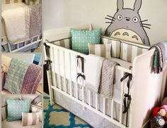 the baby crib is decorated with many different pillows and blankets, along with a totoro wall decal