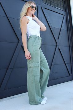 Introducing our Vervet High Rise Utility Cargo Wide Pants in Army Green, the perfect blend of fashion and functionality. These pants feature a flattering high-rise waist and a trendy wide-leg silhouette, offering a comfortable and stylish fit. Embrace the utilitarian charm with multiple cargo pockets, adding practicality to your outfit. Elevate your style with our exclusive Vervet High Rise Utility Cargo Wide Pants, available in store and online. Approx. Inseam-30.5" Materials: 100% Cotton. Mode Sage Green Cargo Pants Outfit, Jean Verde, Wide Leg Cargo Pants Outfit, Green Wide Leg Pants Outfit, Utility Pants Outfit, High Waist Outfits, Green Cargo Pants Outfit, Closet Revamp, Green Pants Outfit