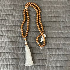 Natural Wood Beaded Tassel Boho Necklace From Francesca’s. Never Been Worn. White Bohemian Beaded Necklace With Tassels, Elegant White Beaded Necklace For Meditation, White Round Beaded Tassel Jewelry, White Tassel Jewelry With Round Beads, Adjustable White Tassel Necklace Gift, White Wooden Beads Jewelry For Meditation, White Wooden Beaded Jewelry For Meditation, Spiritual Beaded Tassel Necklace For Beach, Beaded Tassel Necklace With Round Beads For Beach