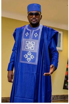 This is an African men agbada. It's available in all sizes and different colors. It's suitable for occasions like wedding, anniversary, birthday, engagements, Thanksgiving and lots more. This outfit is fully customizable, You can reach out to me through afrikrea conversation or WhatsApp (+2348036880228) for customization. Thanks for visiting! Blue Agbada With Traditional Patterns For Ceremonies, Blue Traditional Formal Agbada, Traditional Groom's Agbada For Festive Occasions, Traditional Agbada For Groom In Festive Season, Traditional Festive Agbada For Groom, Ceremonial Long Sleeve Agbada For Eid, Agbada Designs For Men, African Dresses Plus Size, Wedding Suit Groomsmen