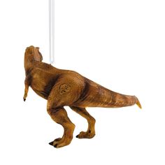 an ornament shaped like a dinosaur hanging from a string