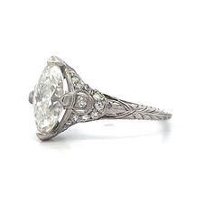 an old cut diamond ring with filigrees